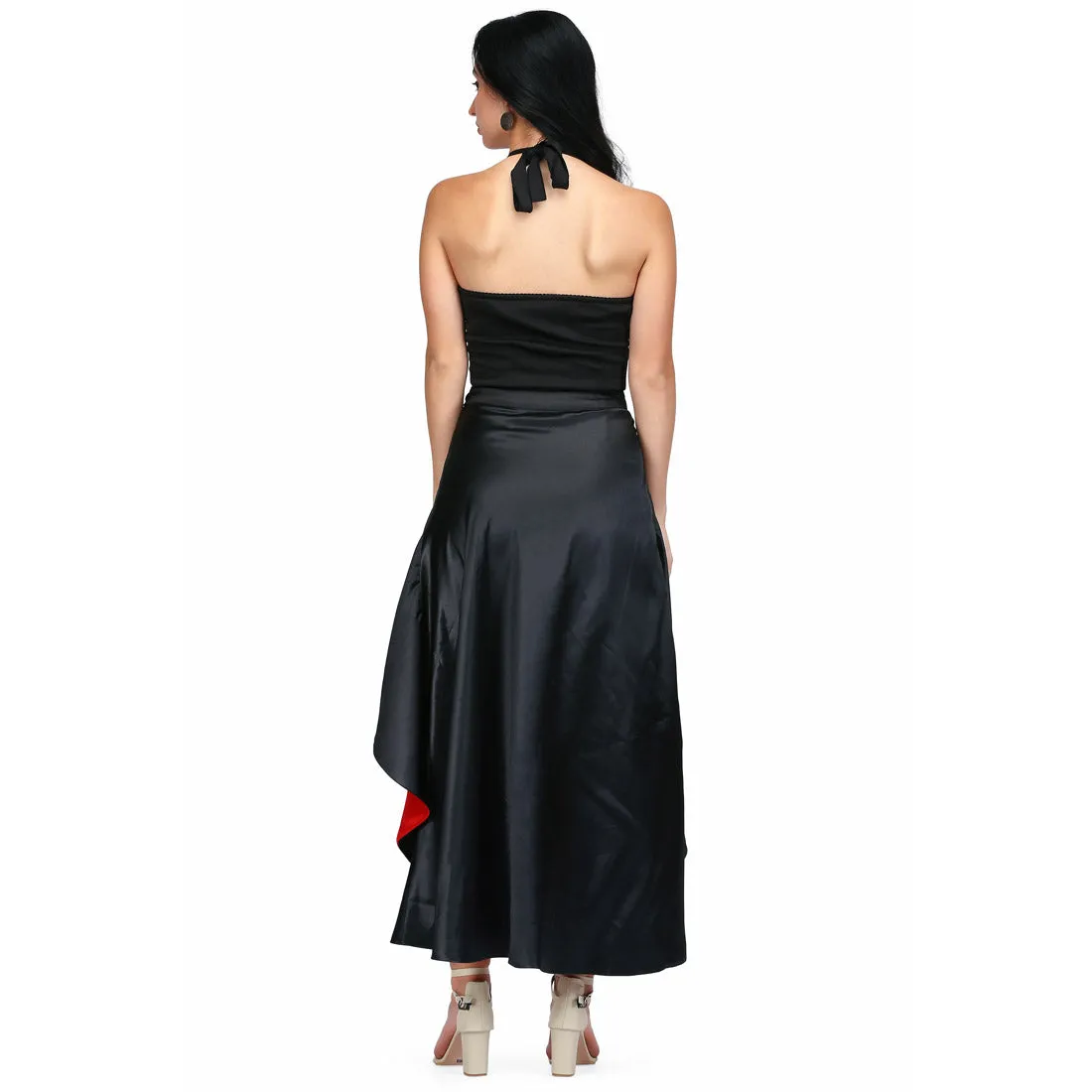 long reversible and overlaped skirt in red and black fabric combined with the black fitted dress
